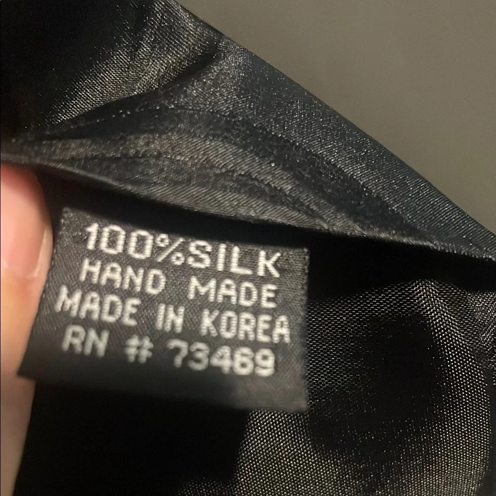 Black Silk Tie with White, Red and Yellow Character Motif